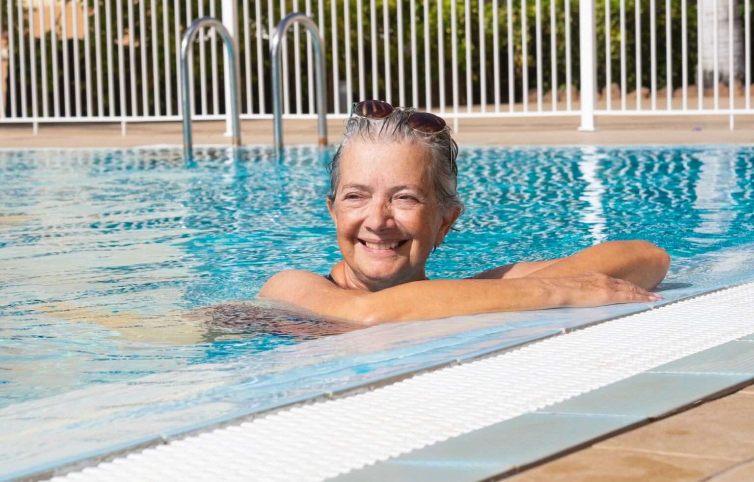 Woman in pool on a sunny day