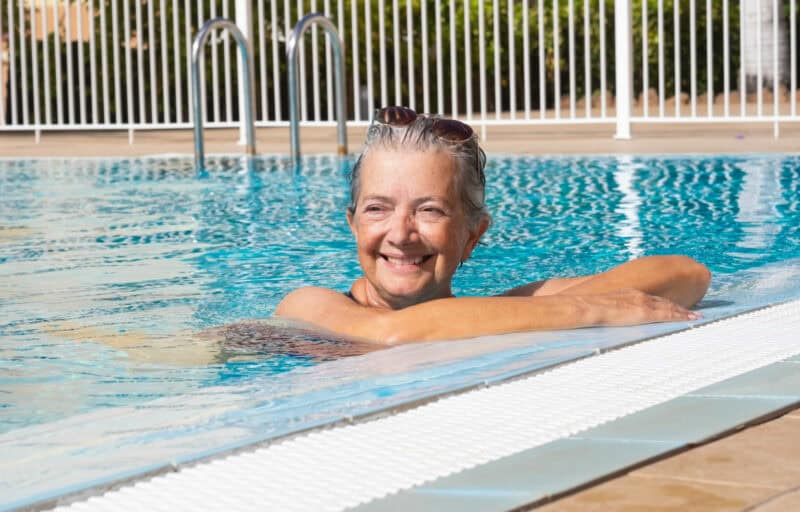 Woman in pool on a sunny day