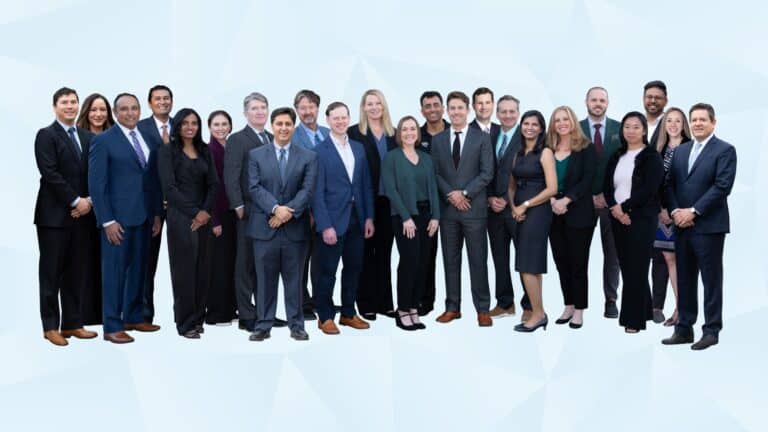 Florida Eye Specialists stand and smile as a group